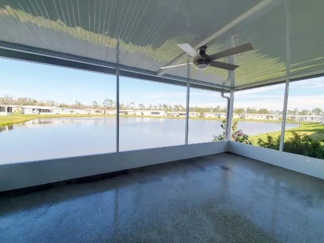 a view of an empty room with a floor to ceiling window