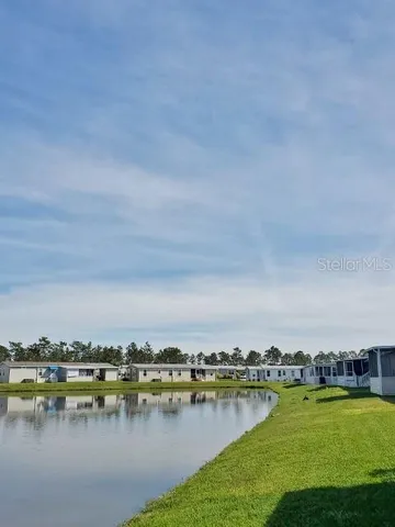 a view of a city with lake view and houses in the back