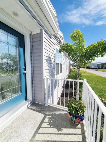 a house with beautiful flower in front of it