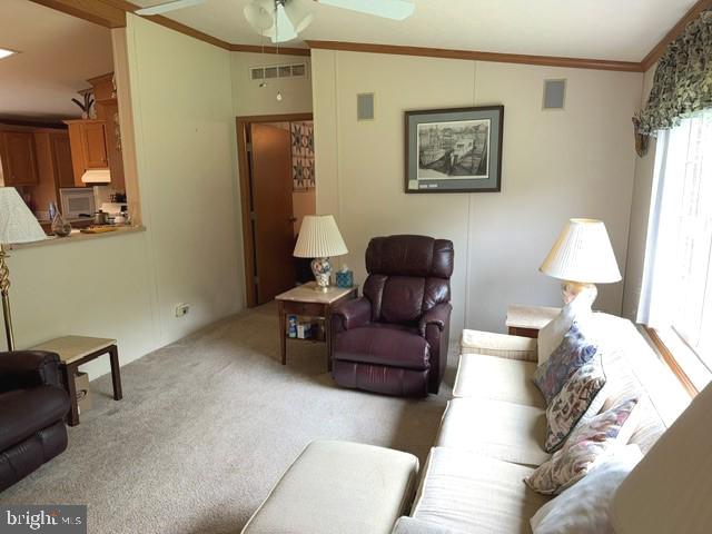 4938 Old Trappe Road Trappe, MD 21673 - Photo 5 of 10 a living room with furniture and a lamp