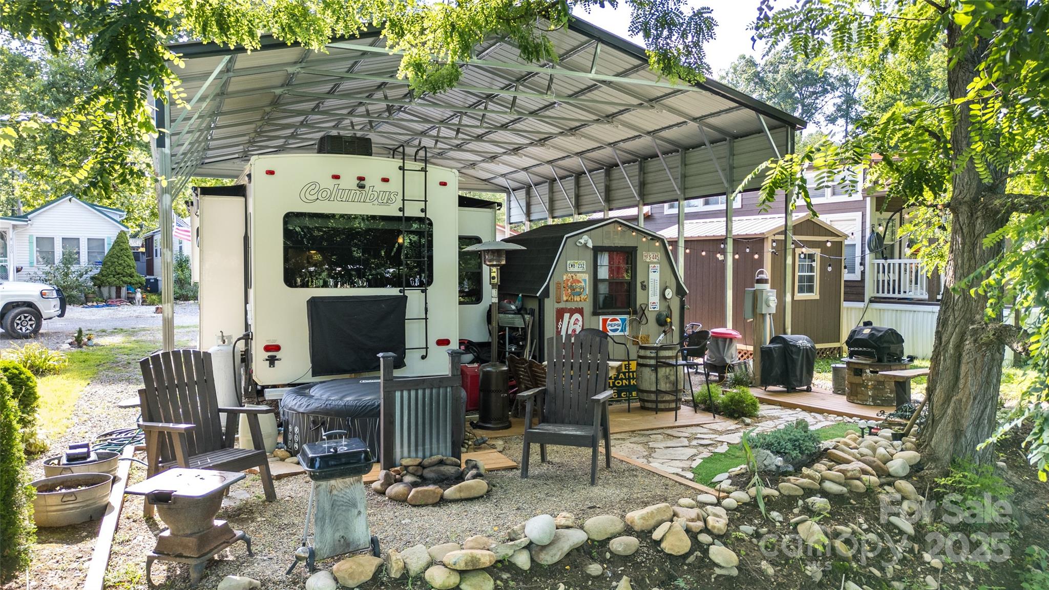 217 Mallard Loop Waynesville, NC 28785 - Photo 3 of 11 a view of a chairs and table in the patio