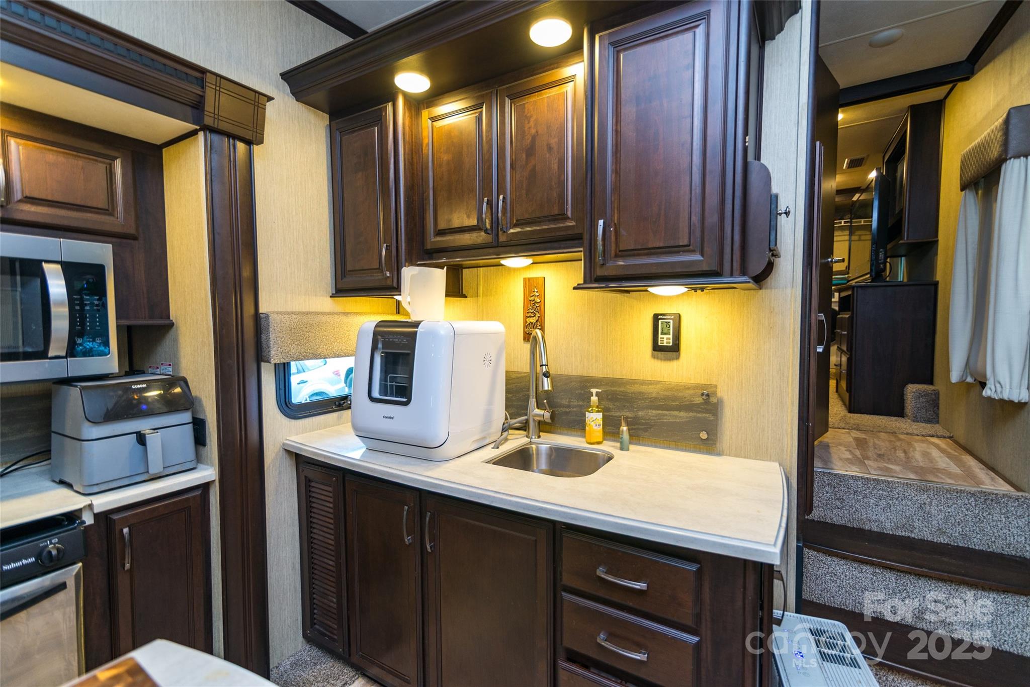 217 Mallard Loop Waynesville, NC 28785 - Photo 6 of 11 a kitchen with a sink and cabinets