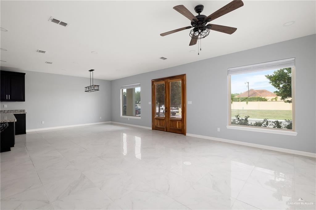 5307 North Crown Point Pharr, TX 78577 - Photo 2 of 11 Unfurnished living room with ceiling fan and light marble finish floors