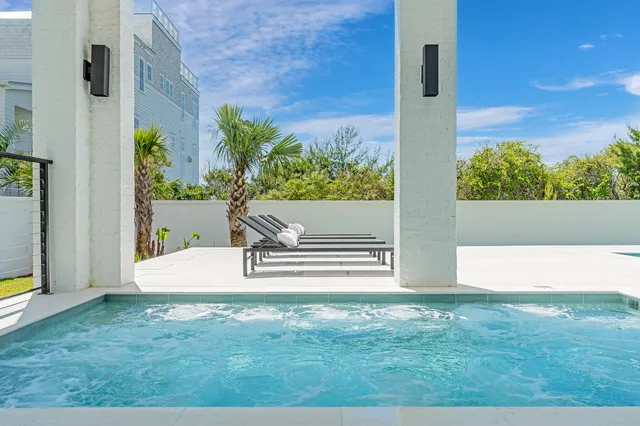 a kitchen with stainless steel appliances granite countertop a sink a stove and refrigerator