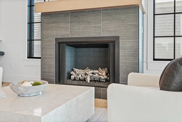 a kitchen with stainless steel appliances granite countertop a stove and white cabinets