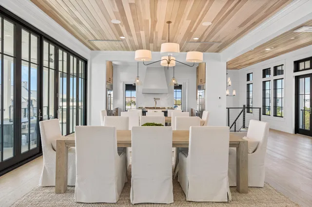 a white bath tub sitting in a bathroom next to a window