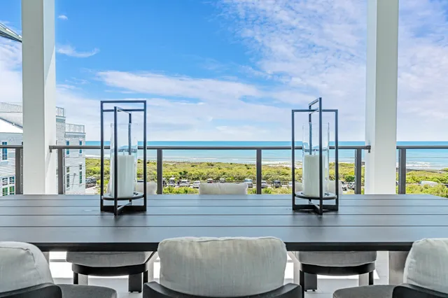 a living room with furniture gym equipment and a large window