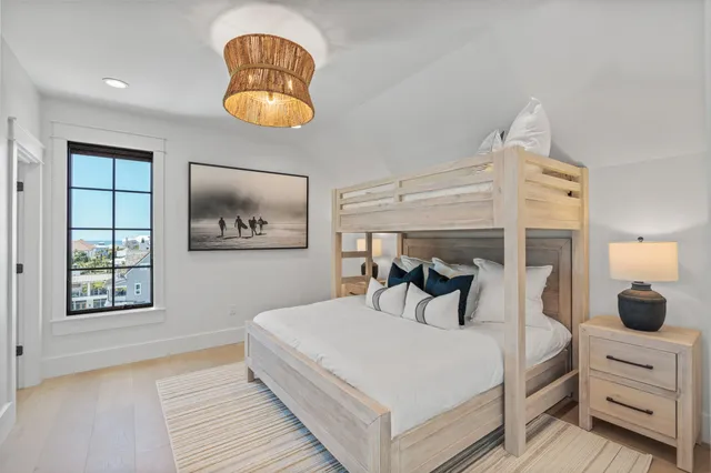 a kitchen with a table chairs stove and cabinets