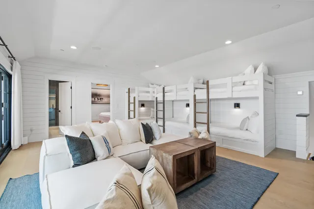a living room with furniture fireplace and a window