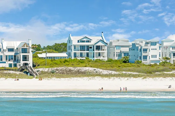 a view of a swimming pool with an outdoor seating and a garden