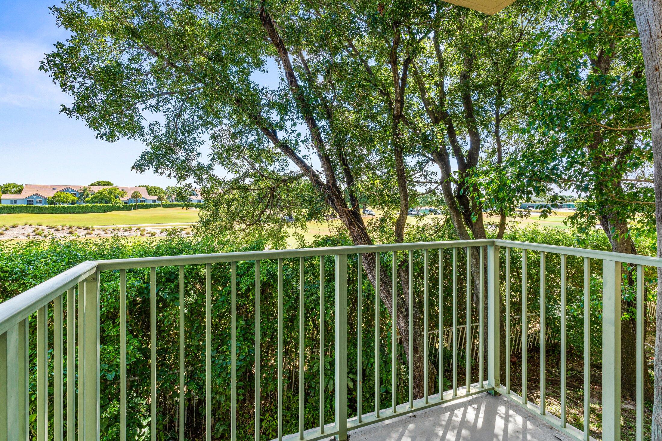 1951 Brandywine Road, Unit 59303 West Palm Beach, FL 33409 - Photo 16 of 25 a view of a balcony with trees
