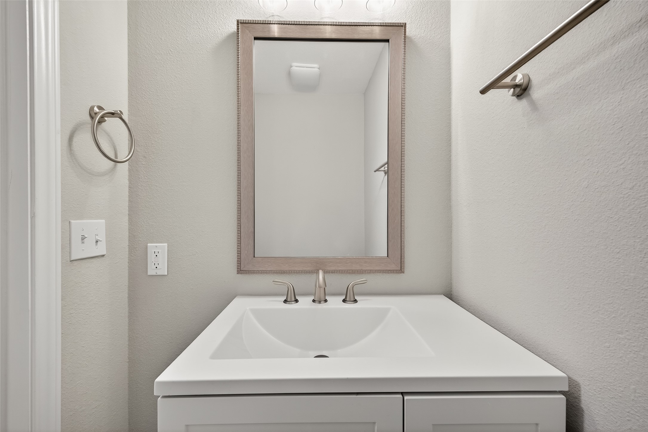 7047 Bissonnet Street, Unit 54 Houston, TX 77074 - Photo 23 of 30 a bathroom with a sink and mirror