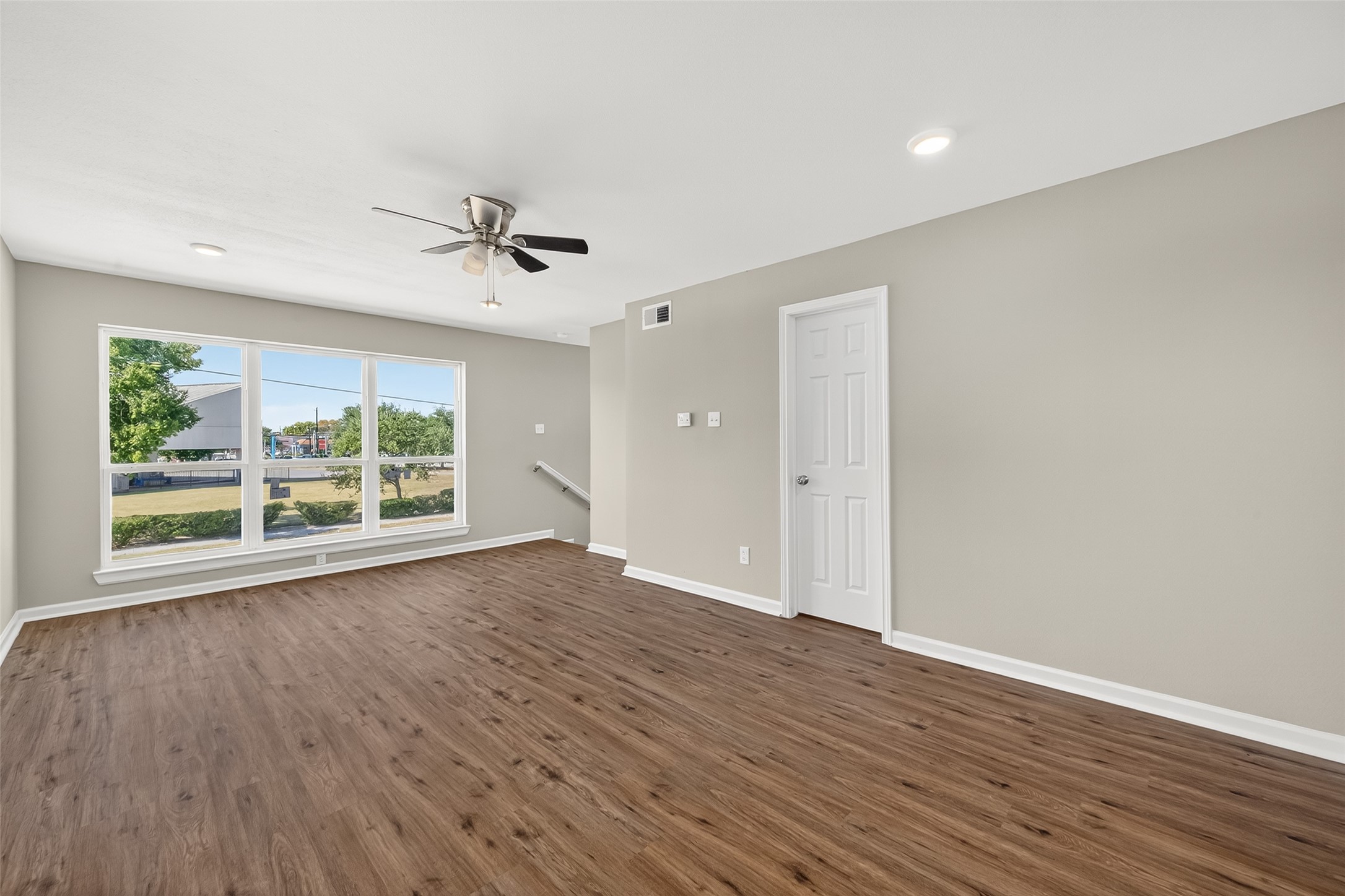 7047 Bissonnet Street, Unit 54 Houston, TX 77074 - Photo 26 of 30 wooden floor in an empty room with a window