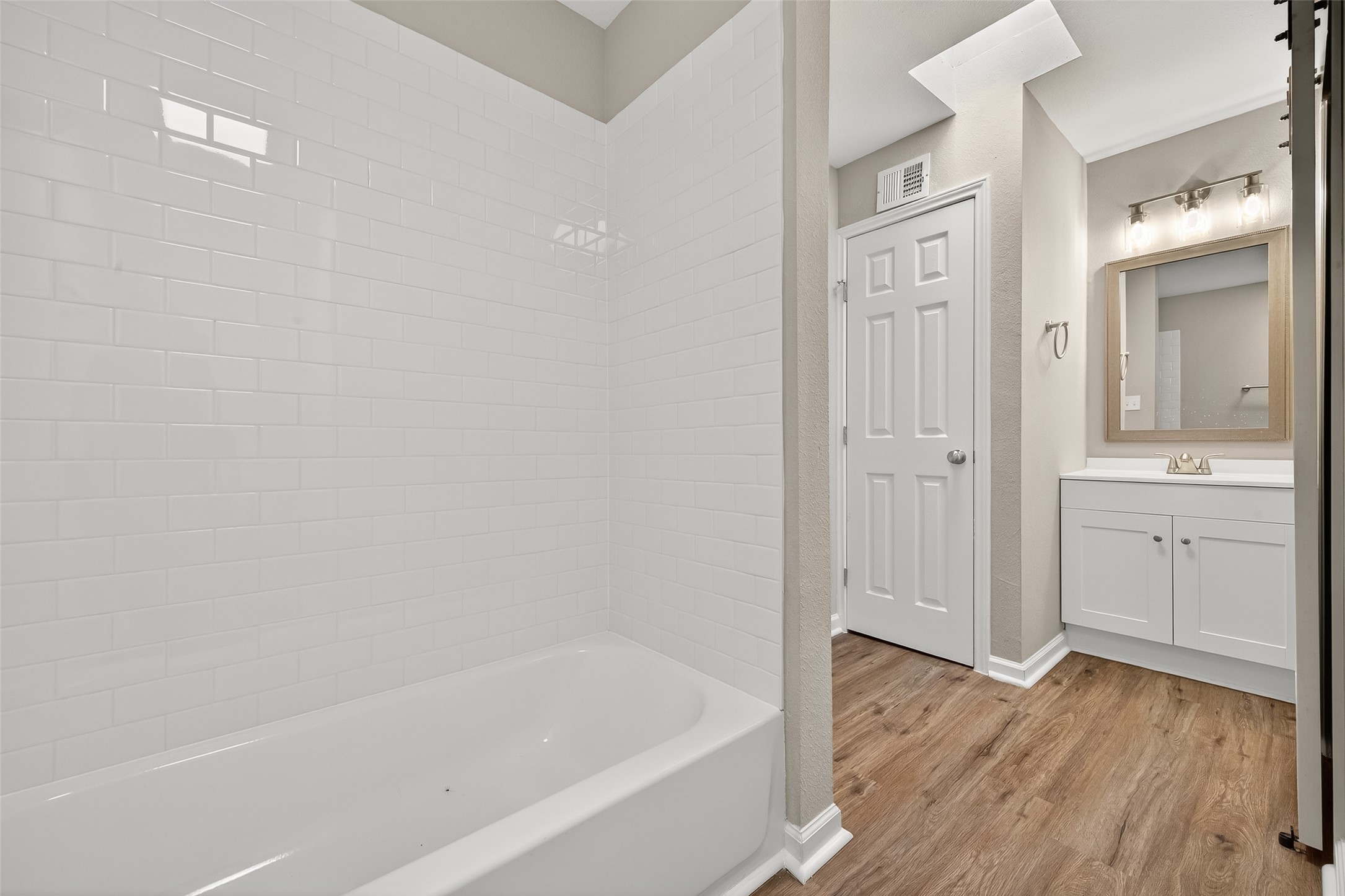 7047 Bissonnet Street, Unit 54 Houston, TX 77074 - Photo 27 of 30 a bathroom with a bathtub and view