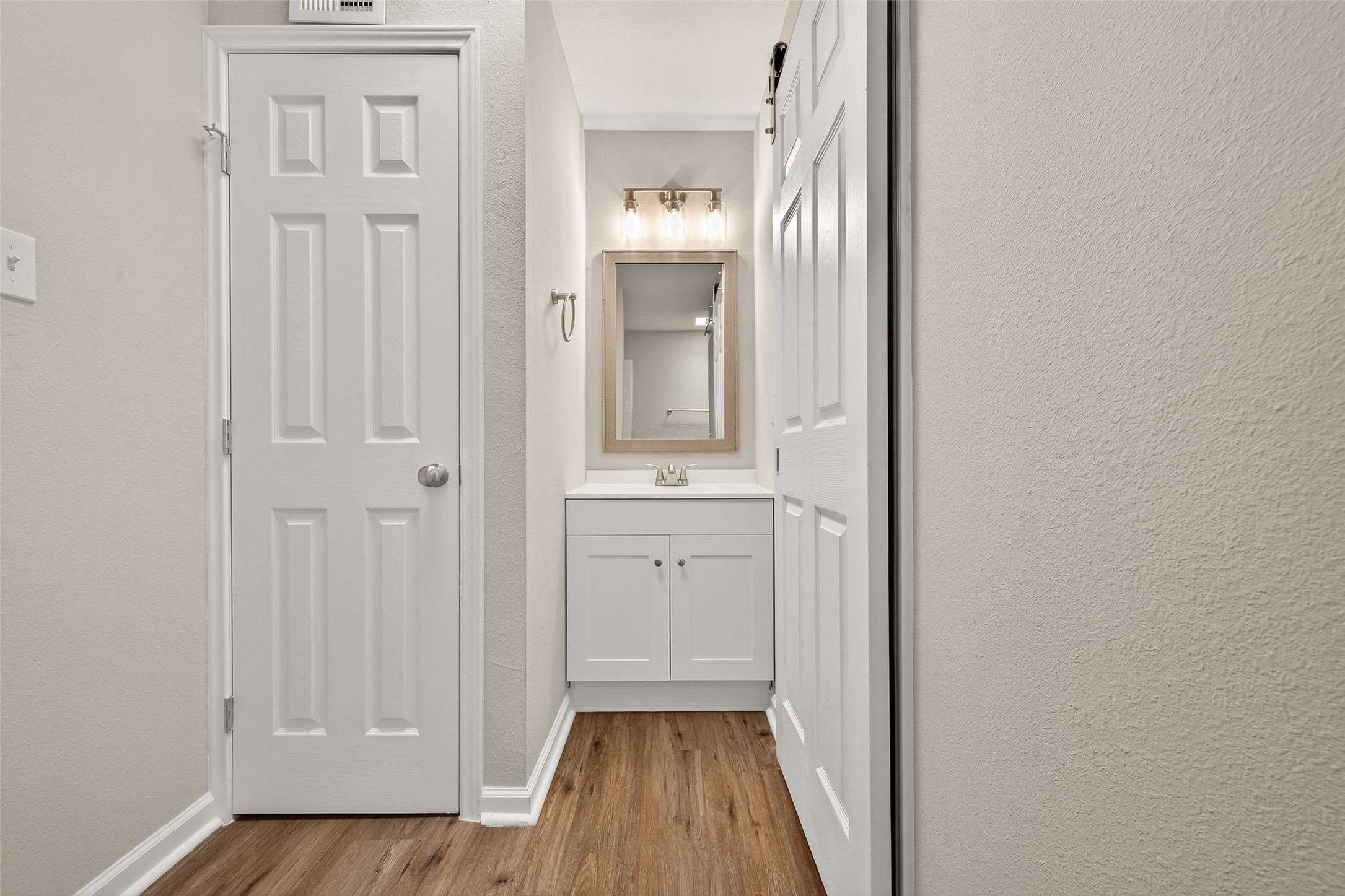 7047 Bissonnet Street, Unit 54 Houston, TX 77074 - Photo 28 of 30 wooden floor in a gallery