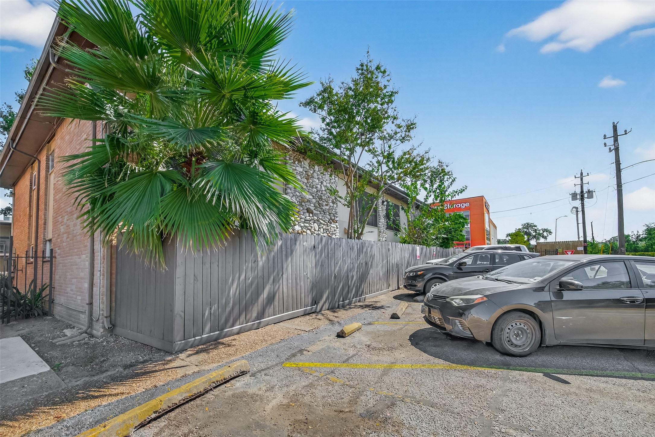 7047 Bissonnet Street, Unit 54 Houston, TX 77074 - Photo 30 of 30 a car parked on the side of a road