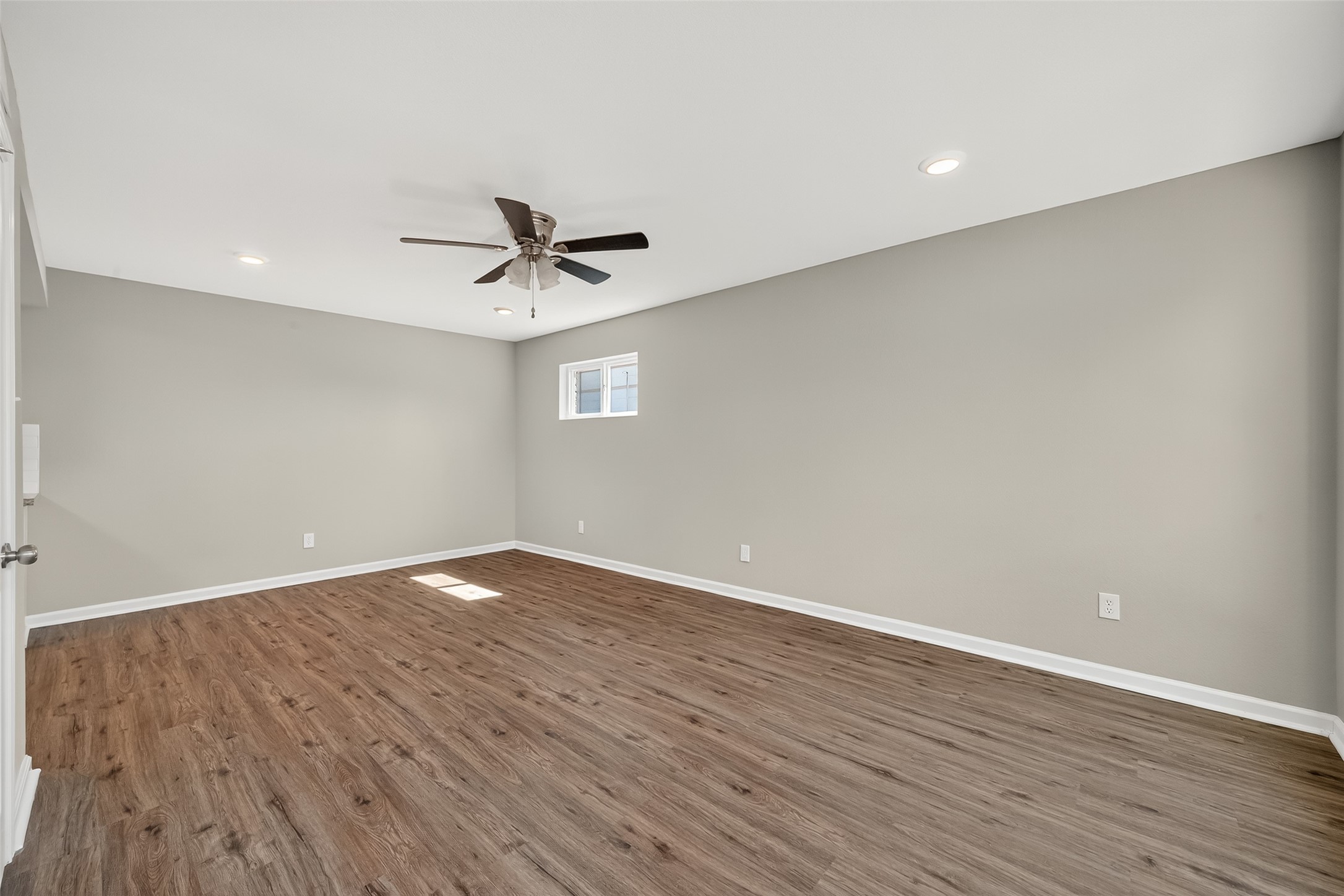 7047 Bissonnet Street, Unit 54 Houston, TX 77074 - Photo 10 of 30 a view of a room with wooden floor and a ceiling fan