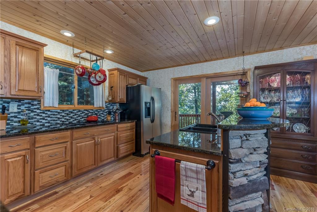 185 Caledonia Road Landrum, SC 29356 - Photo 17 of 30 a kitchen with stove and cabinets