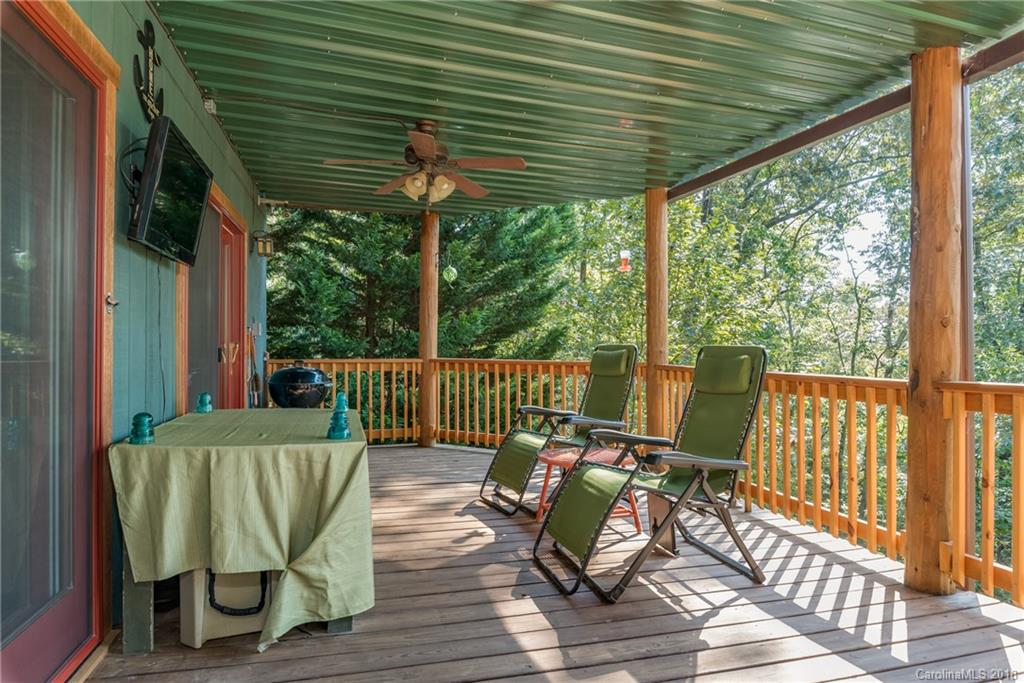 185 Caledonia Road Landrum, SC 29356 - Photo 20 of 30 a view of a chair and table in the balcony