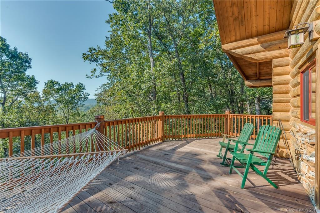 185 Caledonia Road Landrum, SC 29356 - Photo 9 of 30 a view of balcony with wooden floor and seating space