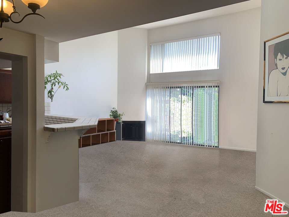 11767 Iowa Avenue, Unit 10 Los Angeles, CA 90025 - Photo 4 of 8 a view of an empty room with a window