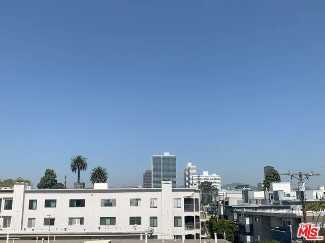a view of residential buildings and street