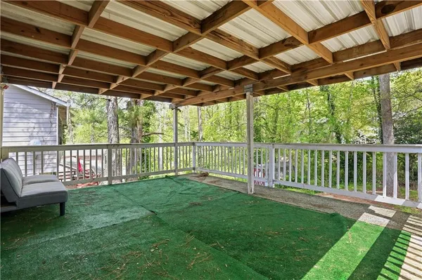 a view of a backyard with wooden floor