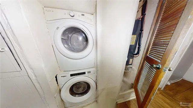 a utility room with sink dryer and washer