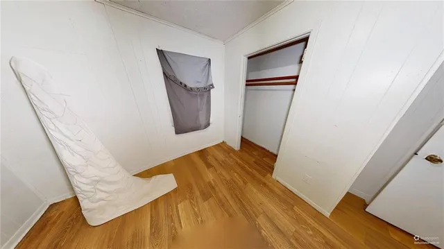 a view of an entryway with wooden floor