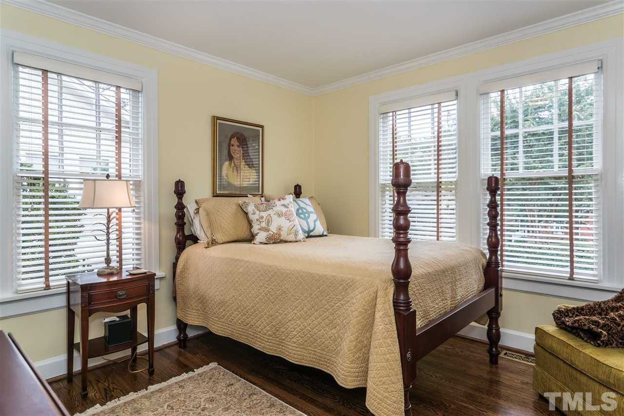 2320 Byrd Street Raleigh, NC 27608 - Photo 17 of 25 a bedroom with a bed and a window