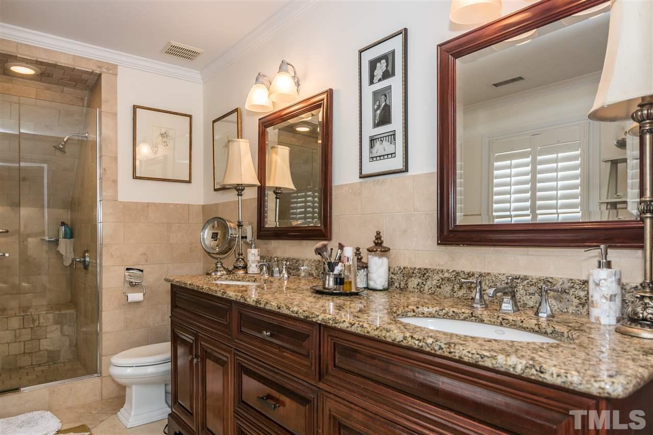 2320 Byrd Street Raleigh, NC 27608 - Photo 19 of 25 a bathroom with a granite countertop toilet sink and mirror