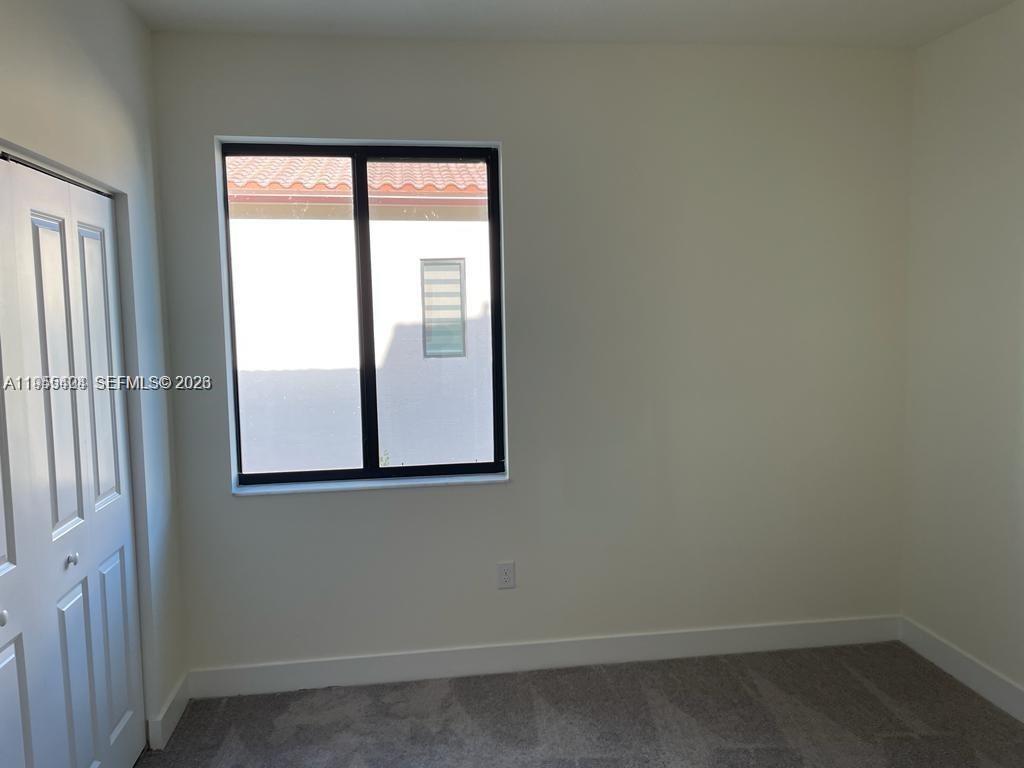 4657 Northwest 83rd Path Doral, FL 33166 - Photo 12 of 23 an empty room with a window