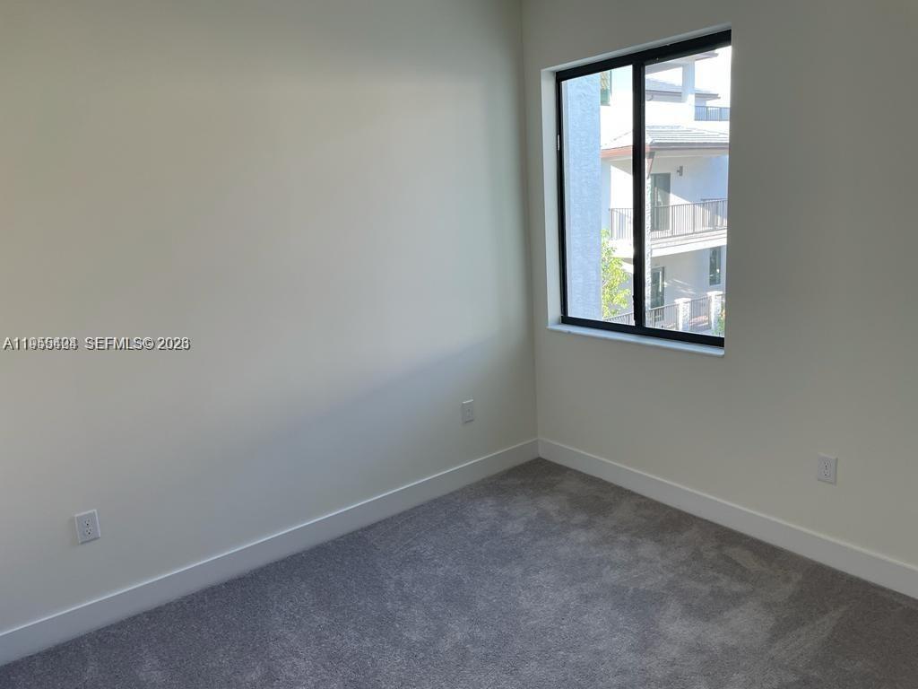 4657 Northwest 83rd Path Doral, FL 33166 - Photo 13 of 23 an empty room with windows