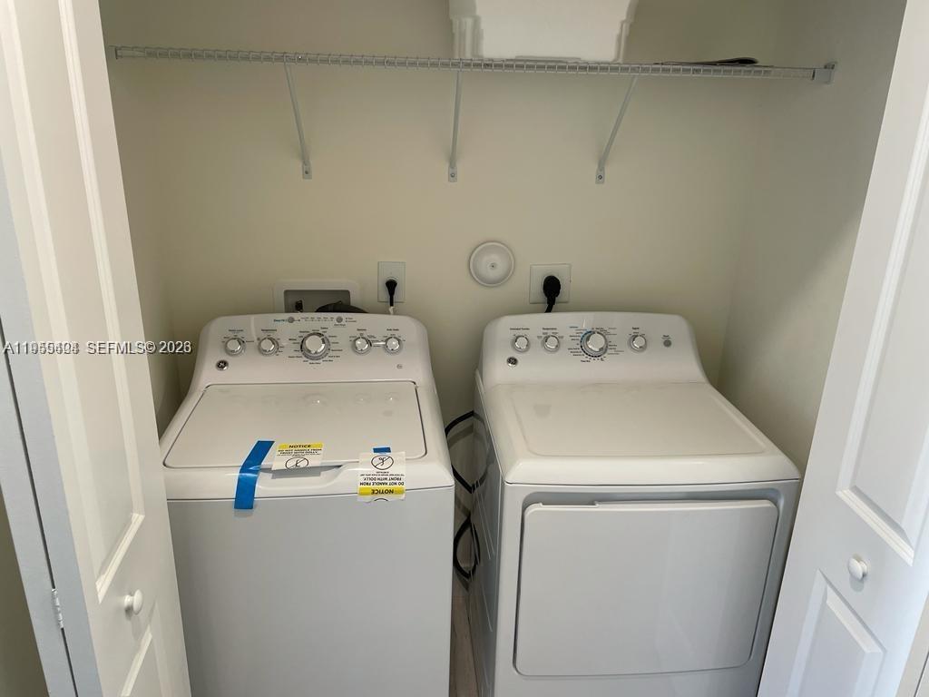 4657 Northwest 83rd Path Doral, FL 33166 - Photo 15 of 23 a utility room with dryer and washer