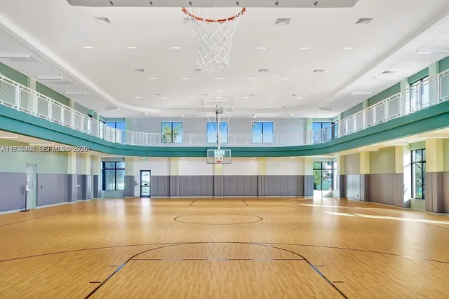 a view of a dining room with furniture and a window