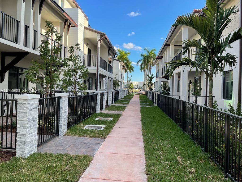 4657 Northwest 83rd Path Doral, FL 33166 - Photo 3 of 23 a view of a pathway with a house