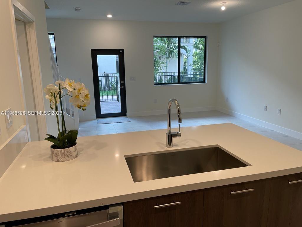 4657 Northwest 83rd Path Doral, FL 33166 - Photo 7 of 23 a kitchen with a sink and a window
