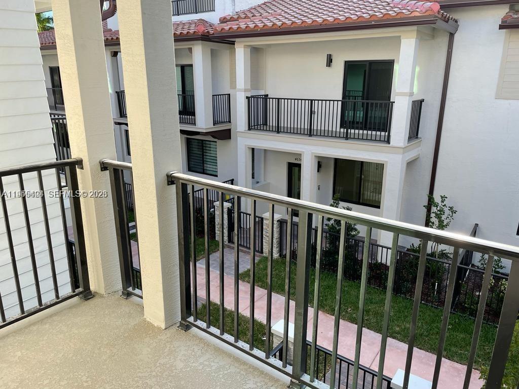 4657 Northwest 83rd Path Doral, FL 33166 - Photo 10 of 23 a view of a brick house with a large window