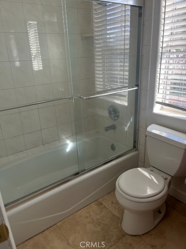 306 Lampman Way Placentia, CA 92870 - Photo 20 of 25 a white toilet sitting next to a bath tub and shower