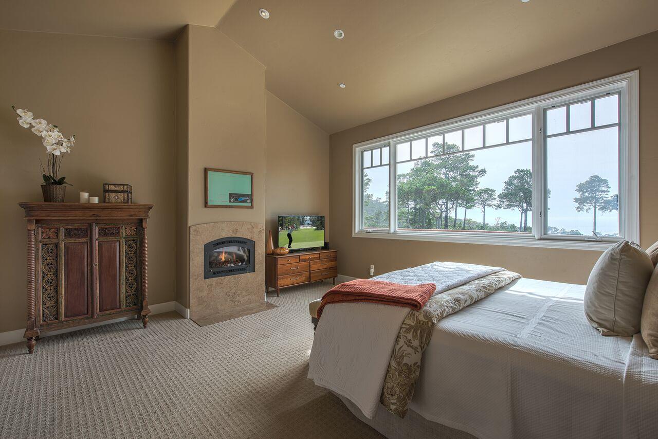 62 Corona Road Carmel, CA 93923 - Photo 16 of 28 a bedroom with a bed and a large window