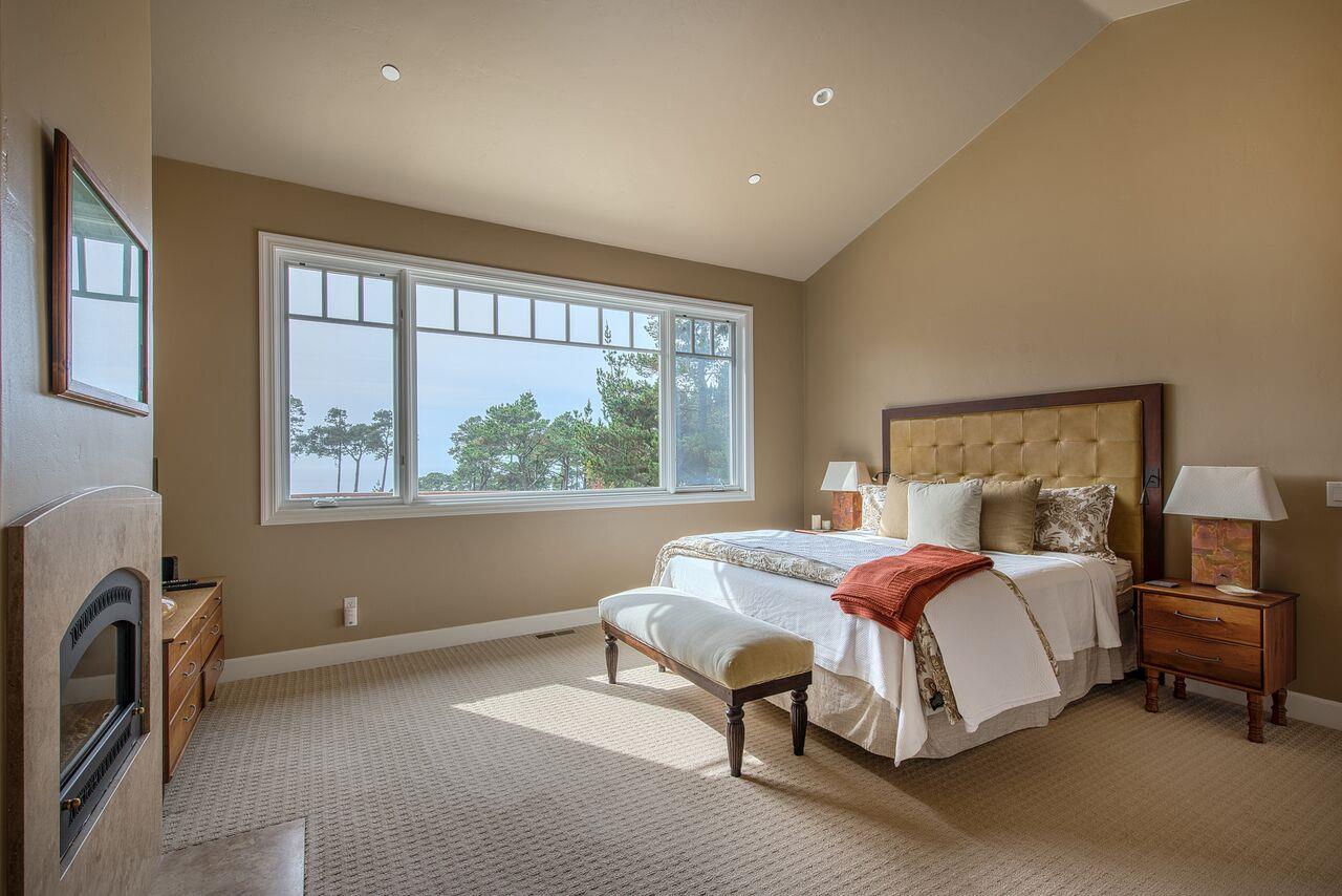62 Corona Road Carmel, CA 93923 - Photo 17 of 28 a spacious bedroom with a bed and a window