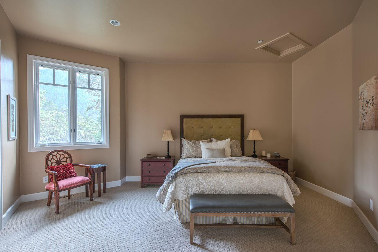 62 Corona Road Carmel, CA 93923 - Photo 21 of 28 a bedroom with a bed chair and a window