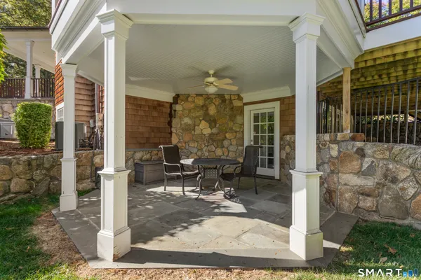 a front view of a house with outdoor seating