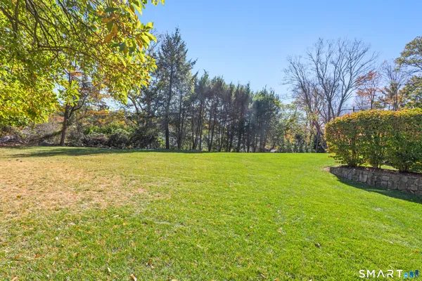a view of outdoor space with deck and yard