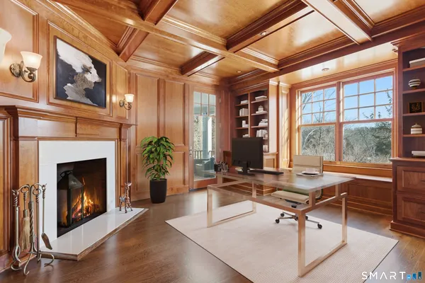 a living room with furniture a window and a fireplace