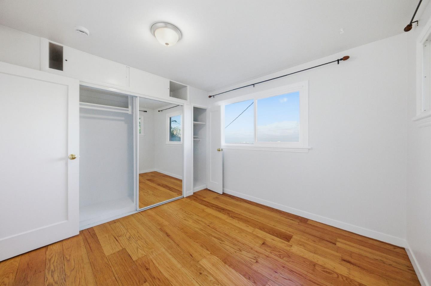 2312 Wooster Avenue Belmont, CA 94002 - Photo 13 of 18 a bedroom with a bed and a closet