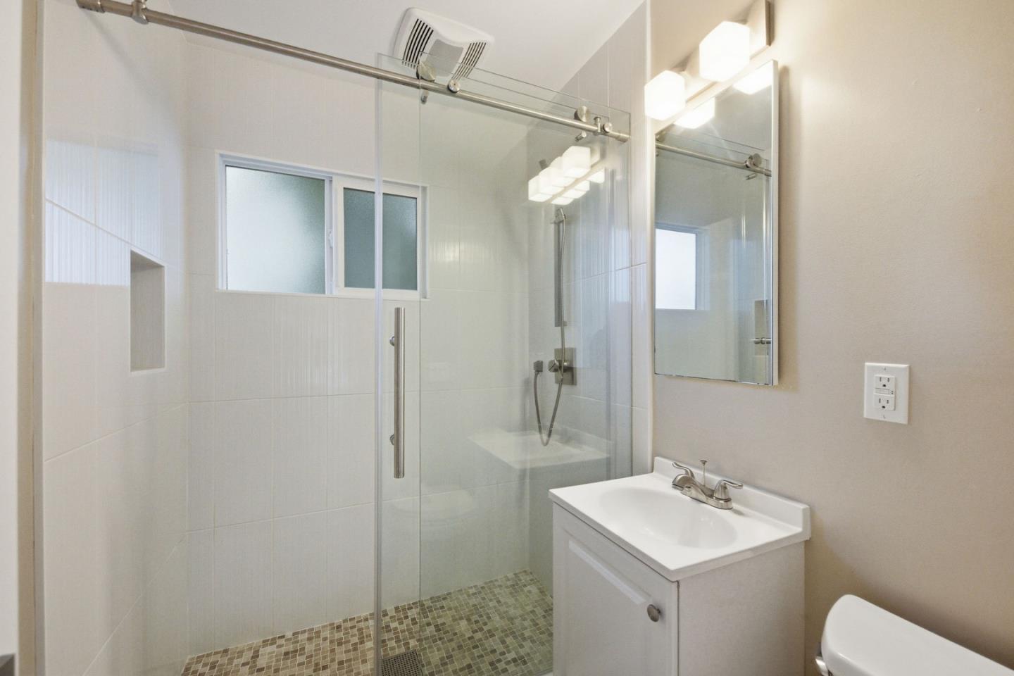 2312 Wooster Avenue Belmont, CA 94002 - Photo 14 of 18 a bathroom with a sink a toilet and shower