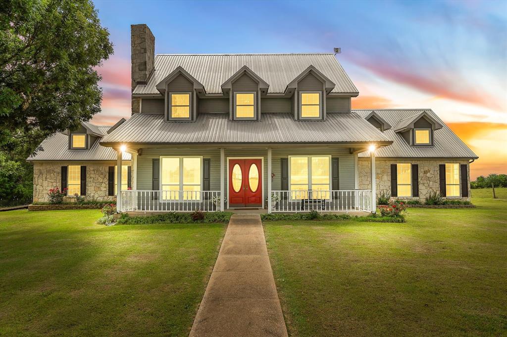 707 Cullins Road Rockwall, TX 75032 - Photo 6 of 40 a front view of a house with a yard