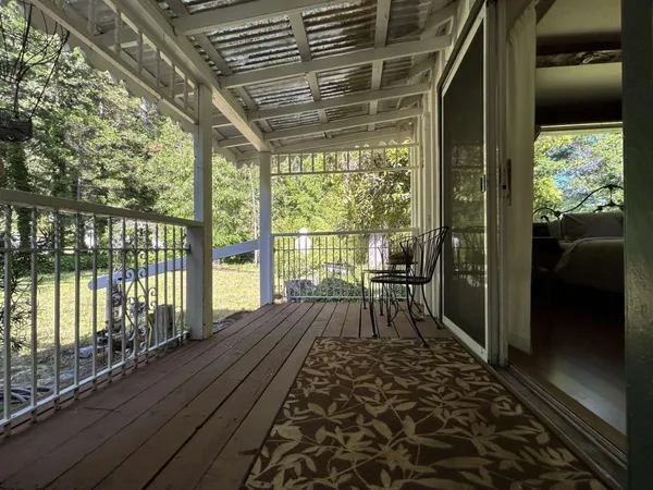 a view of balcony with wooden floor