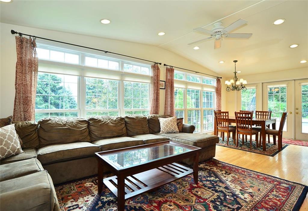10550 Grubbs Road Wexford, PA 15090 - Photo 11 of 25 The massive sunroom has easy access to both the open family room , kitchen and back yard.